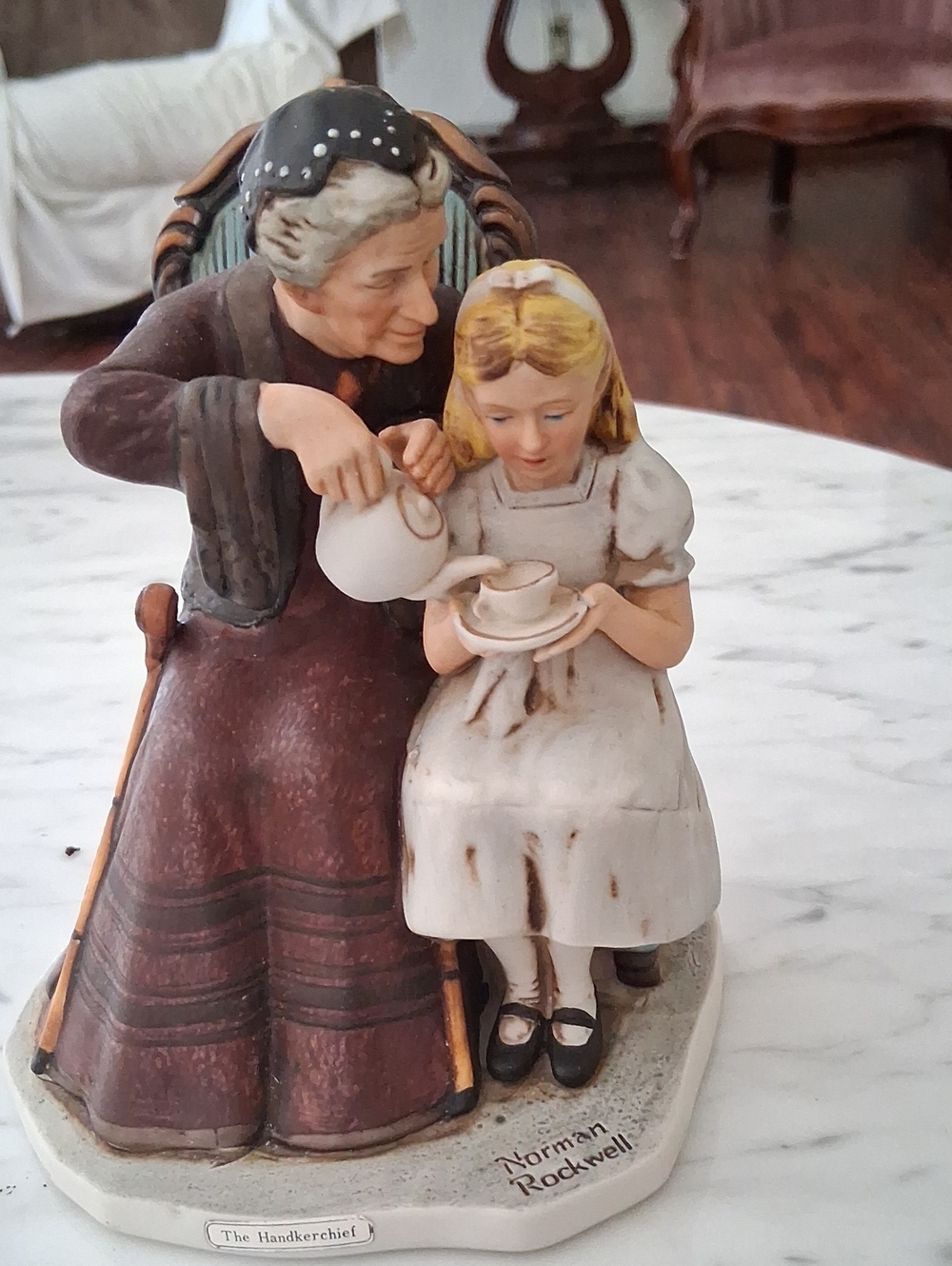 Norman Rockwell vintage-style ceramic figurine in brown, white, cream.